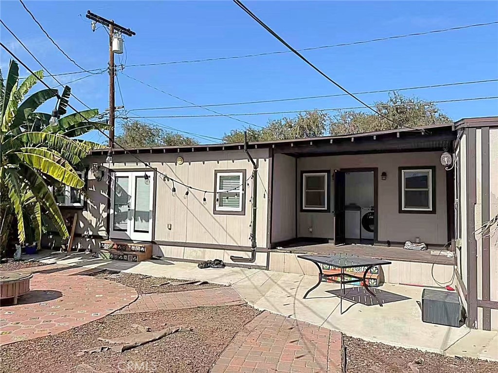 1105 East Walnut Avenue Fullerton, CA 92831 - Photo 13 of 22 a backyard of a house with seating space