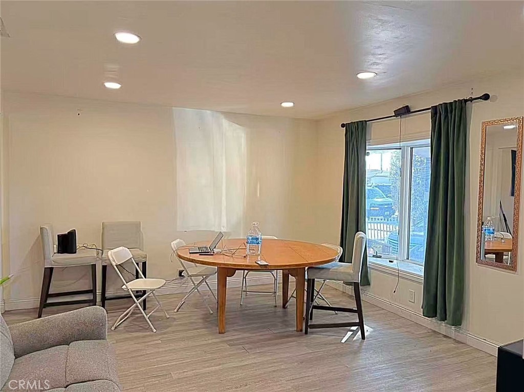 1105 East Walnut Avenue Fullerton, CA 92831 - Photo 2 of 22 a dining room with furniture and wooden floor