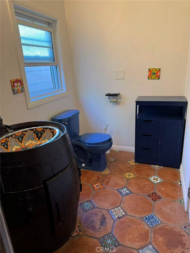 1105 East Walnut Avenue Fullerton, CA 92831 - Photo 22 of 22 a living room with a dresser and a window