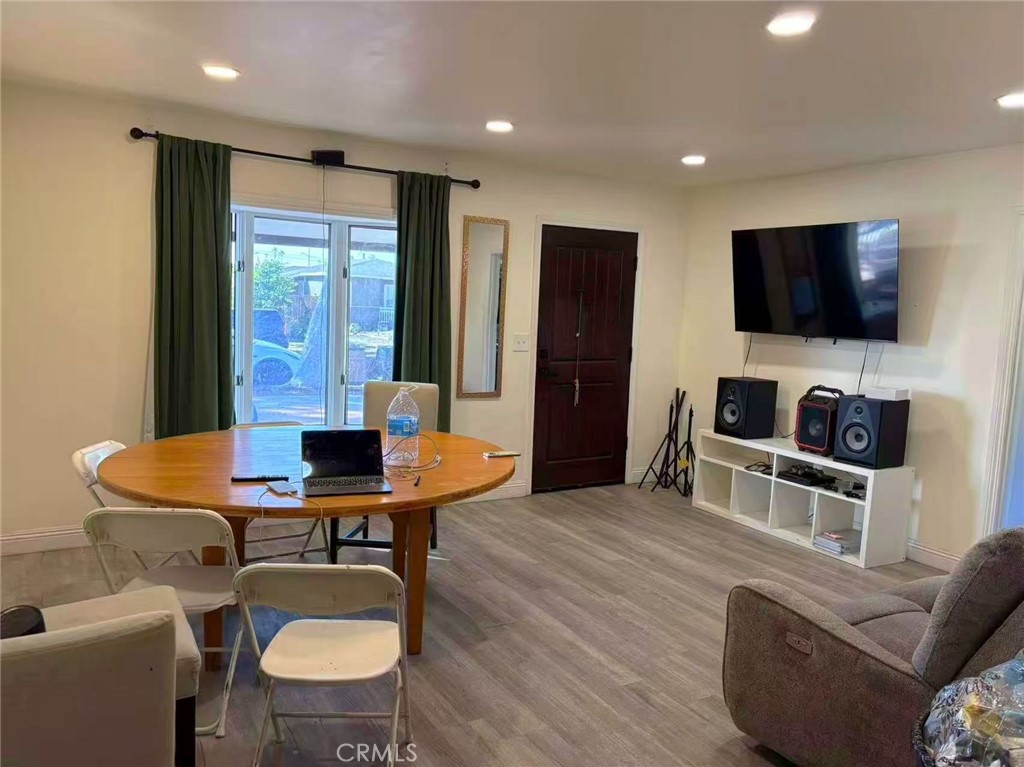1105 East Walnut Avenue Fullerton, CA 92831 - Photo 3 of 22 a living room with furniture and a flat screen tv