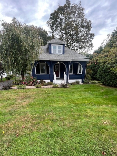 228 Piper Road West Springfield, MA 01089 - Photo 2 of 18 a front view of a house with garden and trees