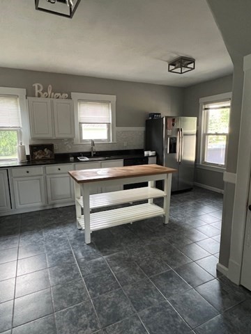 228 Piper Road West Springfield, MA 01089 - Photo 4 of 18 a kitchen with stainless steel appliances a sink a stove a microwave and cabinets