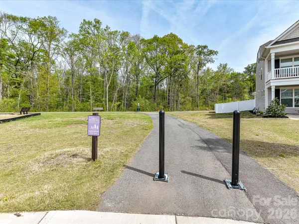 a sign board with a lake view