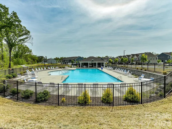 a terrace with outdoor seating and trees