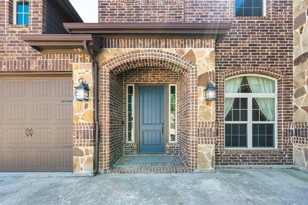 a front view of a house with a glass door