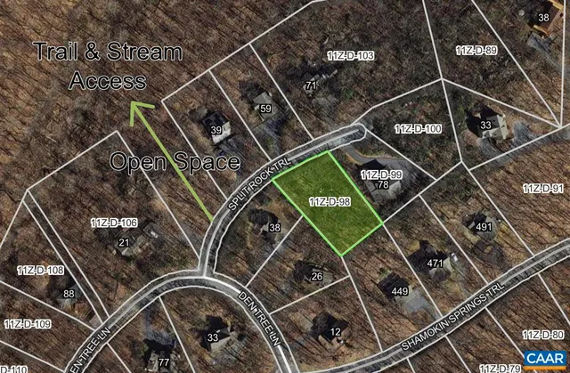 a view of a yard with a tree