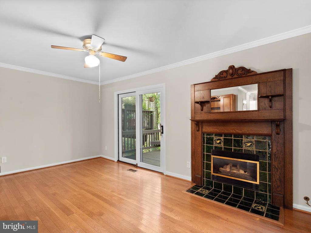 1502 Scandia Circle Reston, VA 20190 - Photo 17 of 42 Family room with deck access and real fireplace