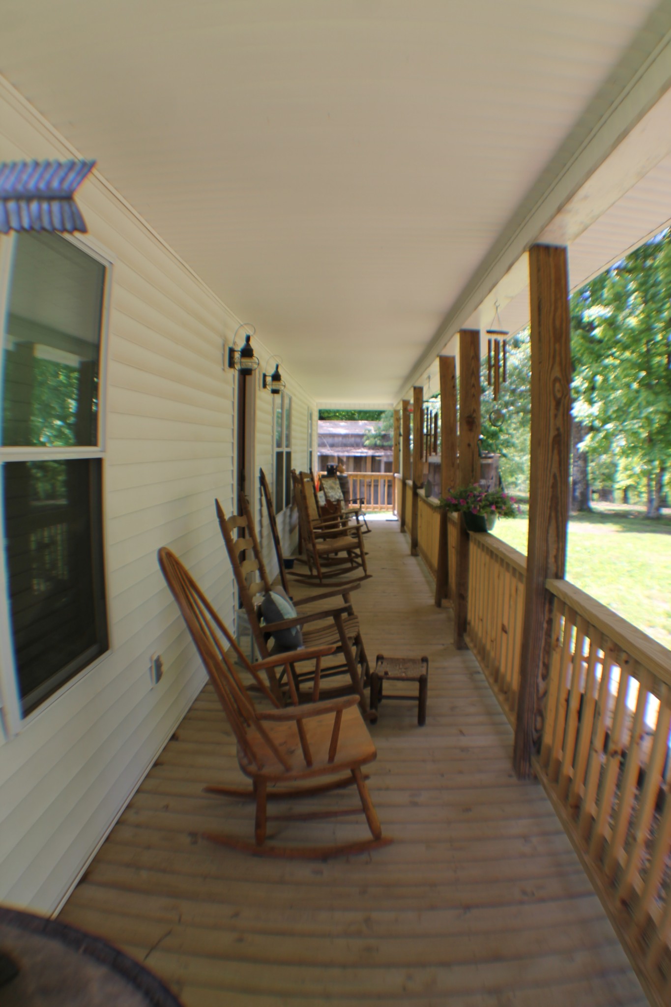 985 Archer Road Lafayette, TN 37083 - Photo 3 of 26 a view of a living room and dining room with wooden floor