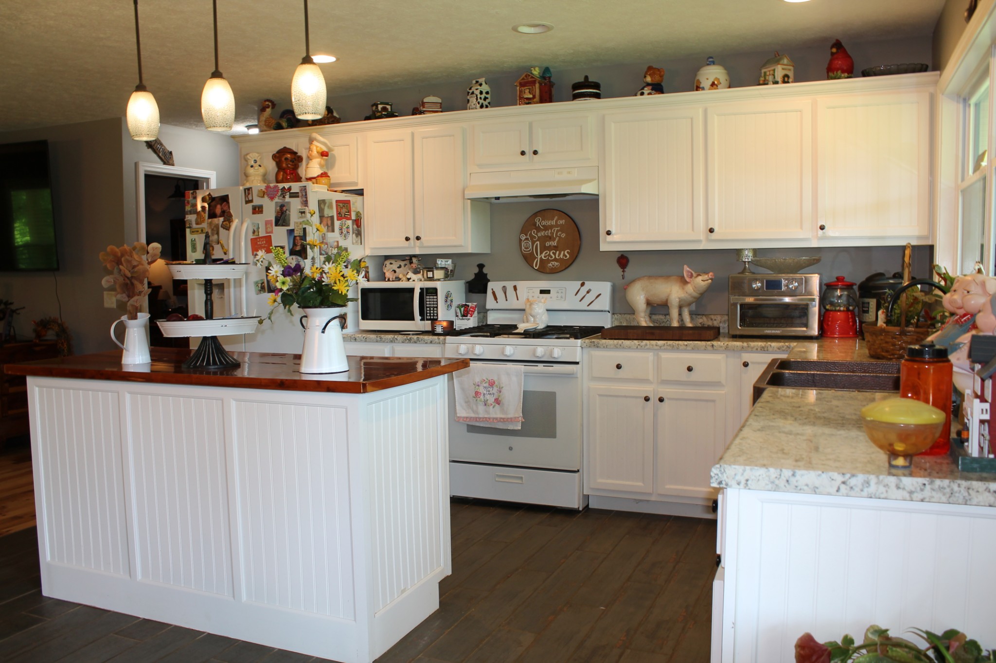 985 Archer Road Lafayette, TN 37083 - Photo 7 of 26 a kitchen with kitchen island granite countertop a sink a stove and cabinets