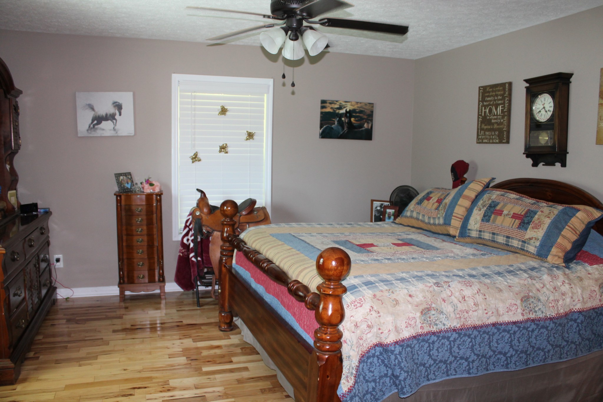 985 Archer Road Lafayette, TN 37083 - Photo 9 of 26 a bedroom with a bed and a chandelier