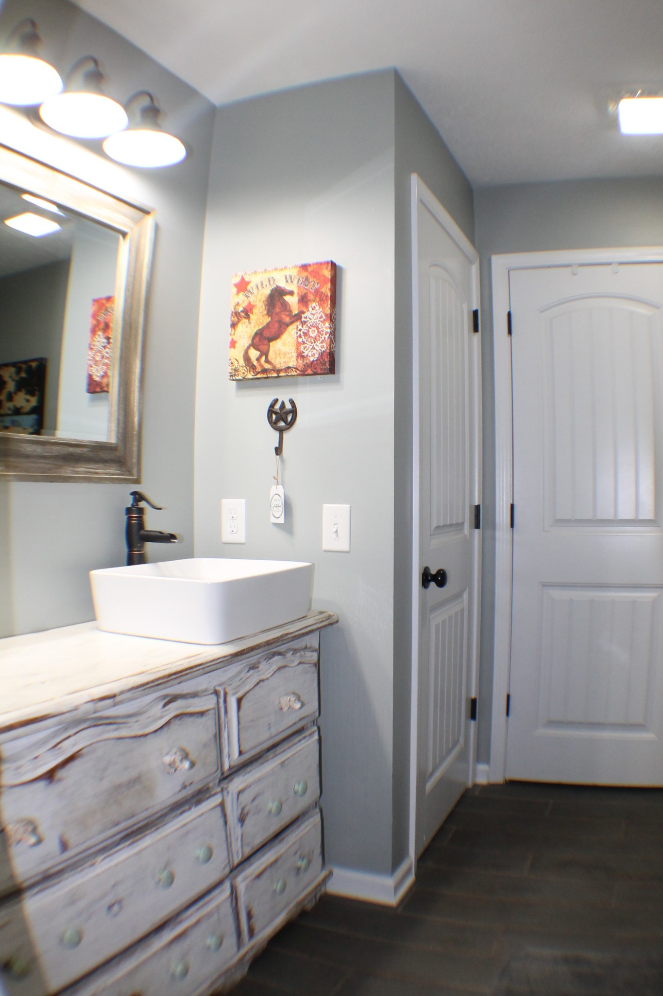 985 Archer Road Lafayette, TN 37083 - Photo 10 of 26 a bathroom with a sink a vanity and a mirror