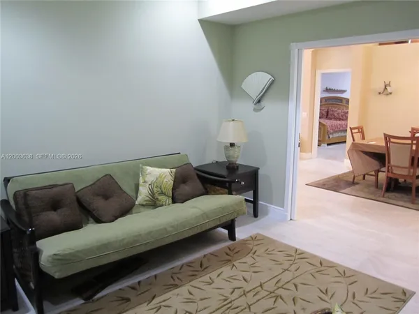 a living room with furniture and a rug
