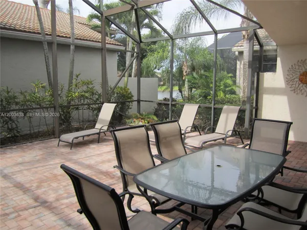 a view of outdoor dining space with a patio