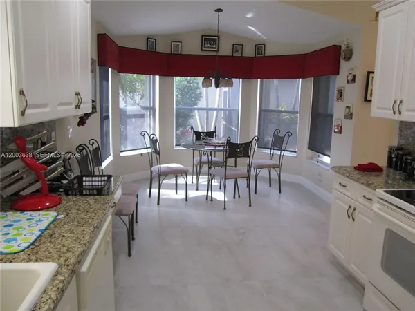 a view of a dining room with furniture