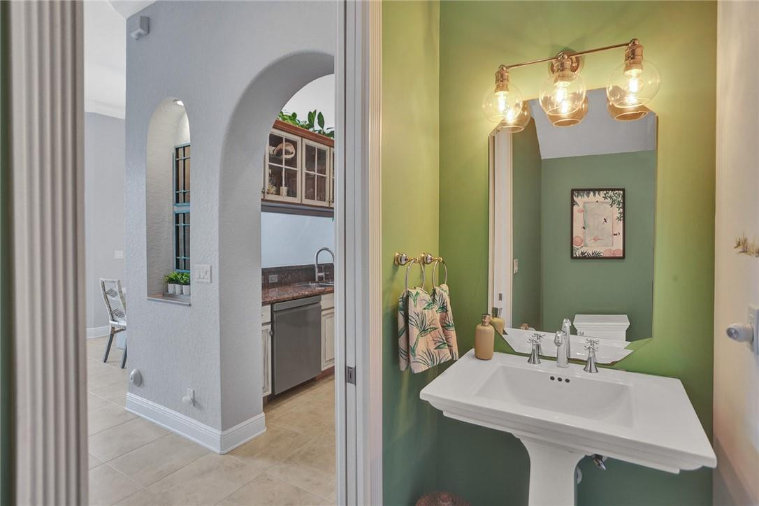 2820 Marina Circle Lighthouse Point, FL 33064 - Photo 12 of 37 a bathroom with a sink and a mirror