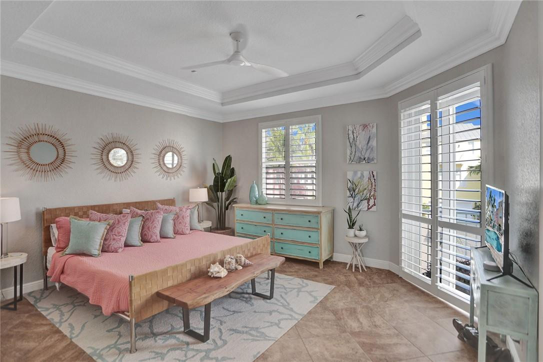 2820 Marina Circle Lighthouse Point, FL 33064 - Photo 13 of 37 a bedroom with a bed and a television