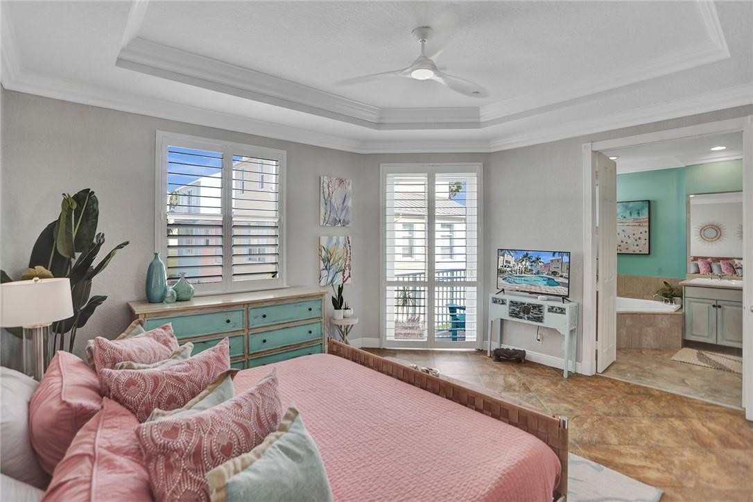 2820 Marina Circle Lighthouse Point, FL 33064 - Photo 14 of 37 a bedroom with a bed dresser and a window