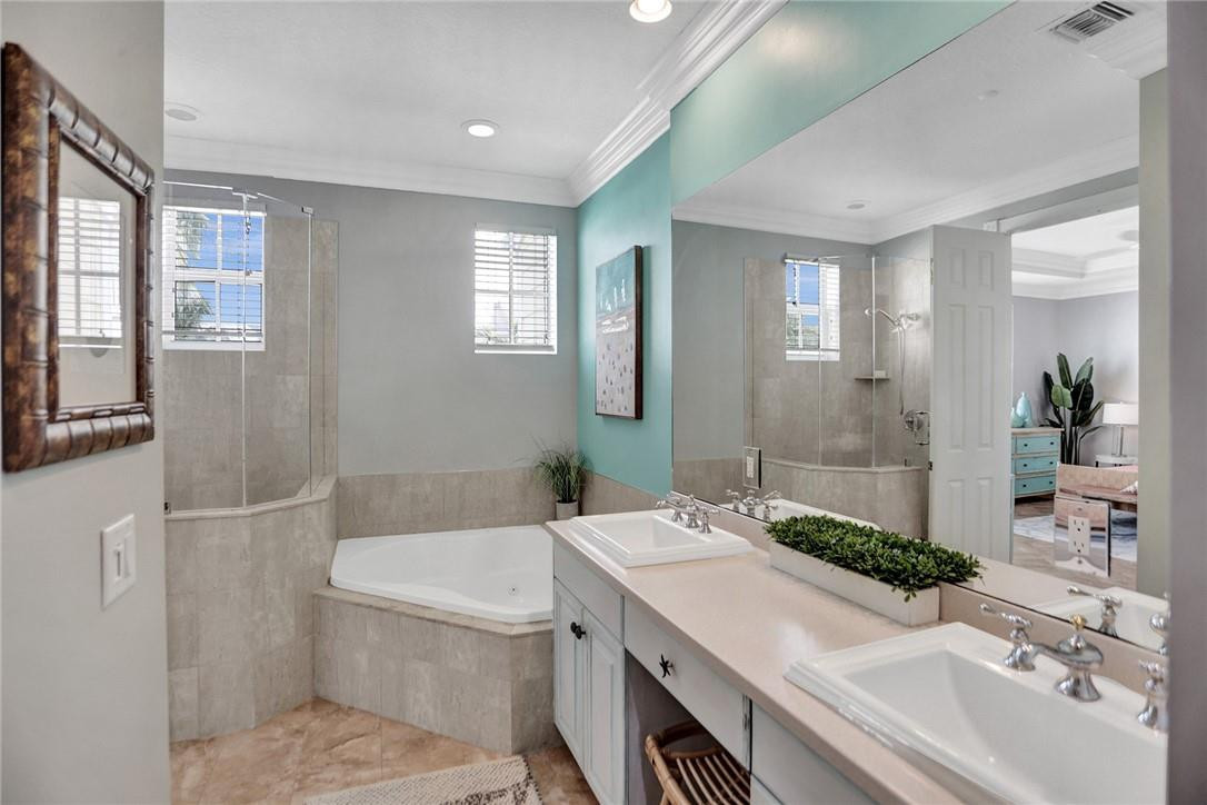 2820 Marina Circle Lighthouse Point, FL 33064 - Photo 16 of 37 a bathroom with a sink and a mirror