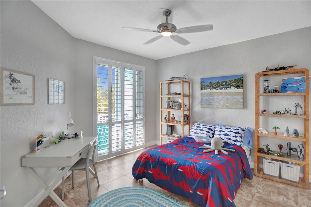 2820 Marina Circle Lighthouse Point, FL 33064 - Photo 17 of 37 a bedroom with a bed and a couch