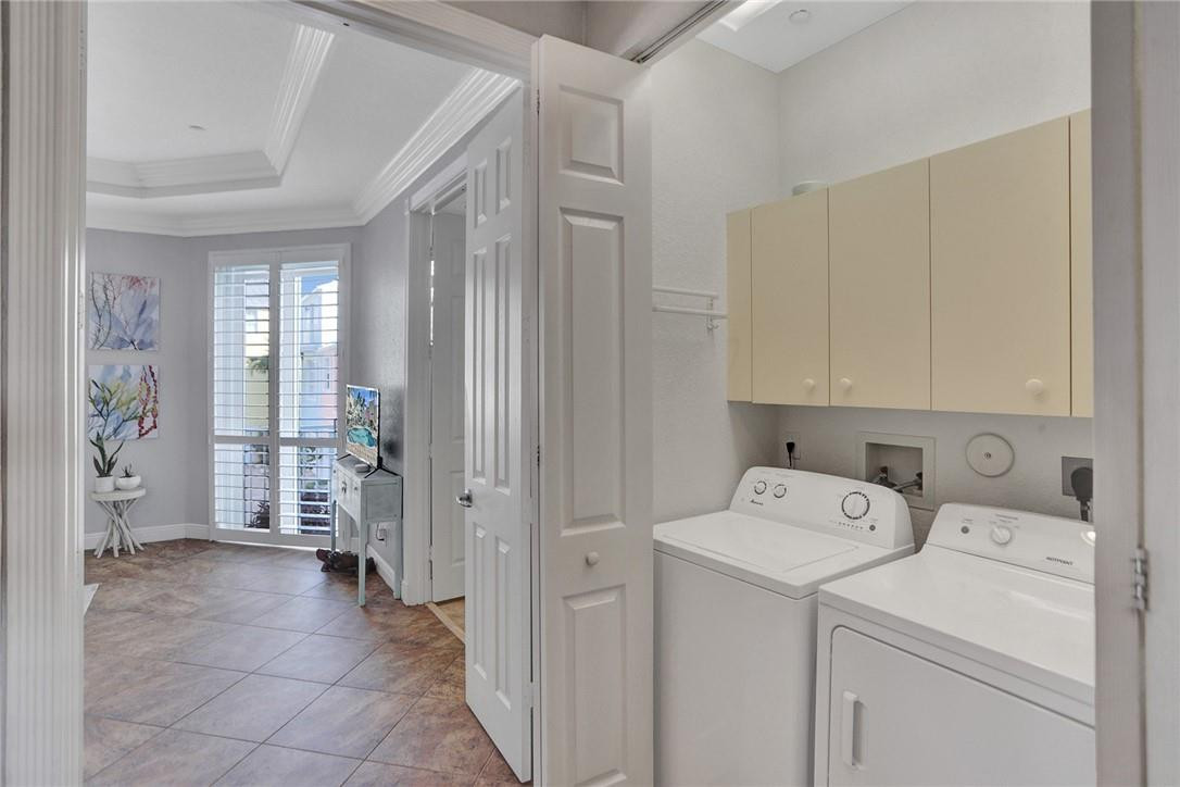 2820 Marina Circle Lighthouse Point, FL 33064 - Photo 22 of 37 a view of utility room with washer and dryer