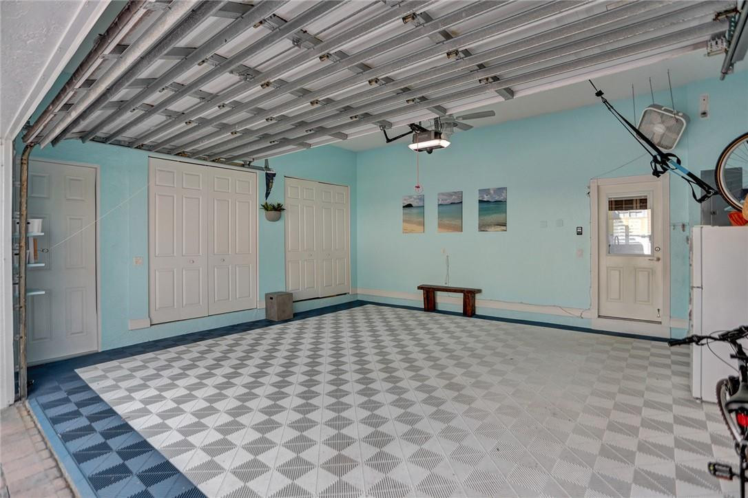 2820 Marina Circle Lighthouse Point, FL 33064 - Photo 26 of 37 a bedroom with a bed and a chandelier