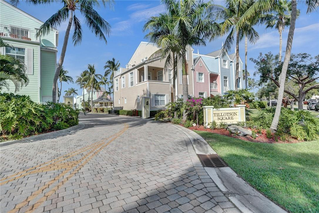 2820 Marina Circle Lighthouse Point, FL 33064 - Photo 29 of 37 a front view of a house with a garden