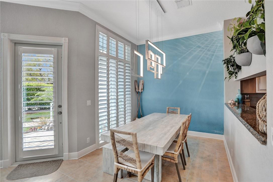 2820 Marina Circle Lighthouse Point, FL 33064 - Photo 9 of 37 a view of a dining room with furniture window and wooden floor