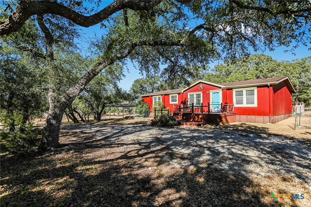 5300 Fischer Store Road Wimberley, TX 78676 - Photo 1 of 1 a view of a house with a yard