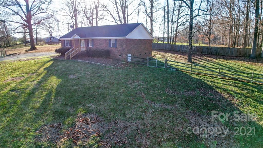 4123 Unionville Road Monroe, NC 28110 - Photo 5 of 27 a view of a house with a yard