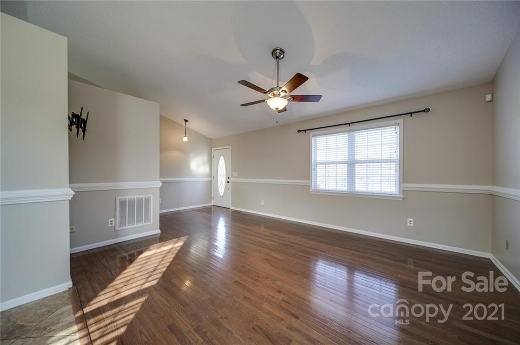 4123 Unionville Road Monroe, NC 28110 - Photo 10 of 27 wooden floor in an empty room with a window
