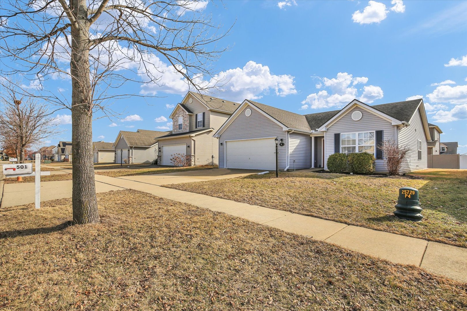 501 Luria Lane Champaign, IL 61822 - Photo 2 of 33 a front view of a house with a yard