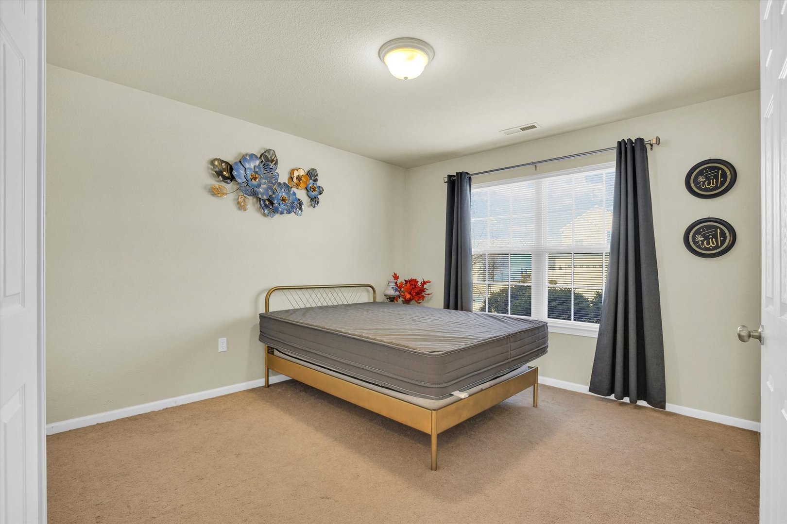 501 Luria Lane Champaign, IL 61822 - Photo 23 of 33 a bed sitting in a bedroom next to a window
