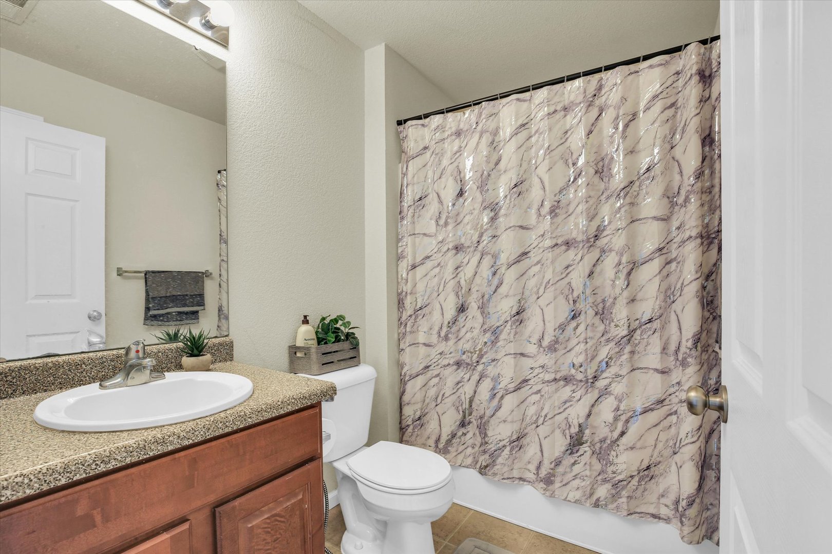 501 Luria Lane Champaign, IL 61822 - Photo 25 of 33 a bathroom with a sink and a mirror
