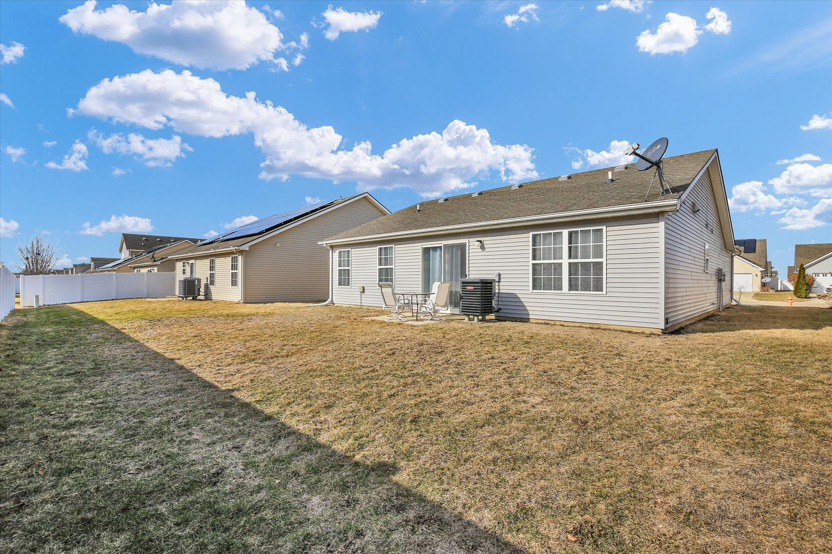 501 Luria Lane Champaign, IL 61822 - Photo 30 of 33 a view of a house with a backyard and windows