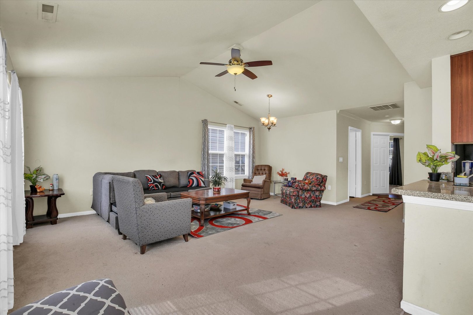 501 Luria Lane Champaign, IL 61822 - Photo 10 of 33 a living room with furniture and a chandelier