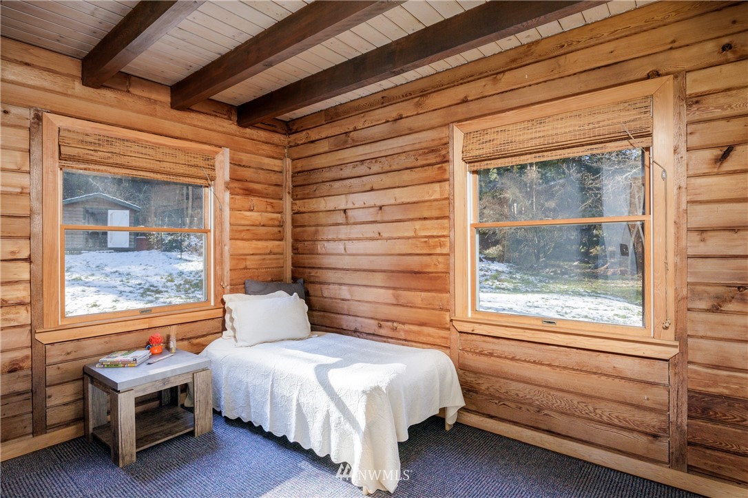 230 Eliza Road Lopez Island, WA 98261 - Photo 12 of 26 a bedroom with a bed and a window