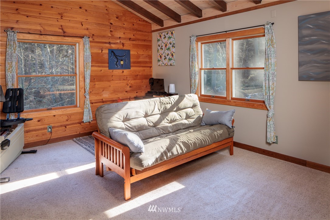 230 Eliza Road Lopez Island, WA 98261 - Photo 17 of 26 a bedroom with furniture and a window