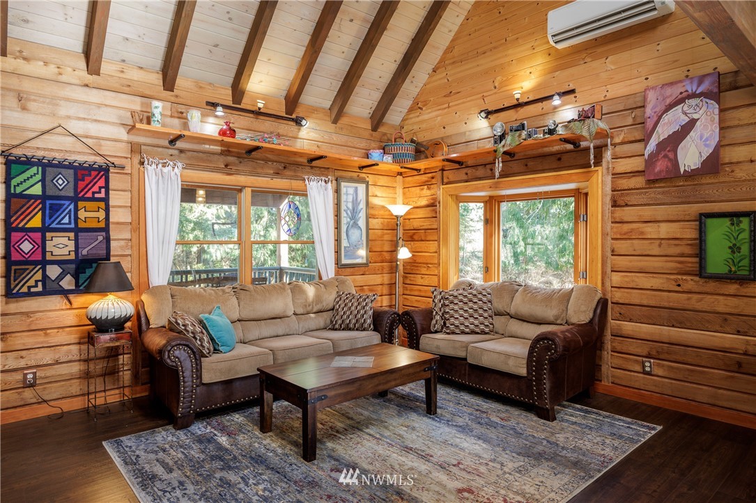 230 Eliza Road Lopez Island, WA 98261 - Photo 2 of 26 a living room with furniture a rug and a window