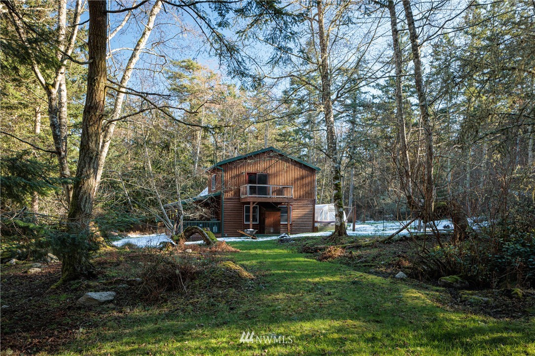 230 Eliza Road Lopez Island, WA 98261 - Photo 22 of 26 a backyard of a house with lots of green space