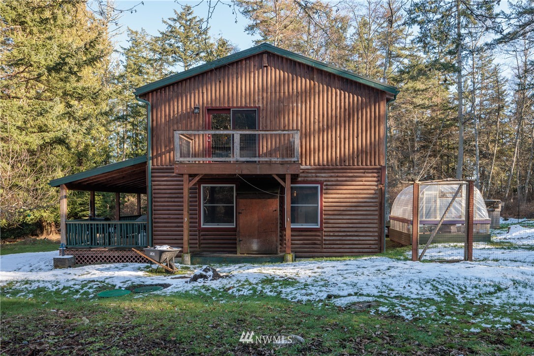 230 Eliza Road Lopez Island, WA 98261 - Photo 23 of 26 a front view of a house with garden