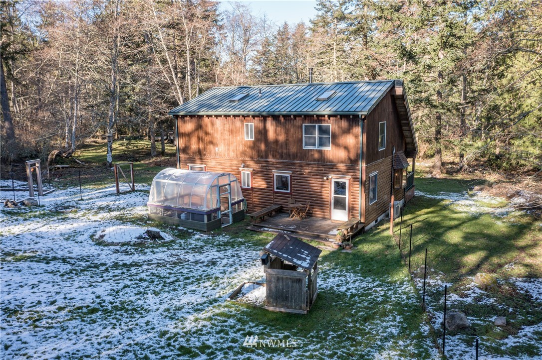 230 Eliza Road Lopez Island, WA 98261 - Photo 25 of 26 a view of a house with a yard and roof