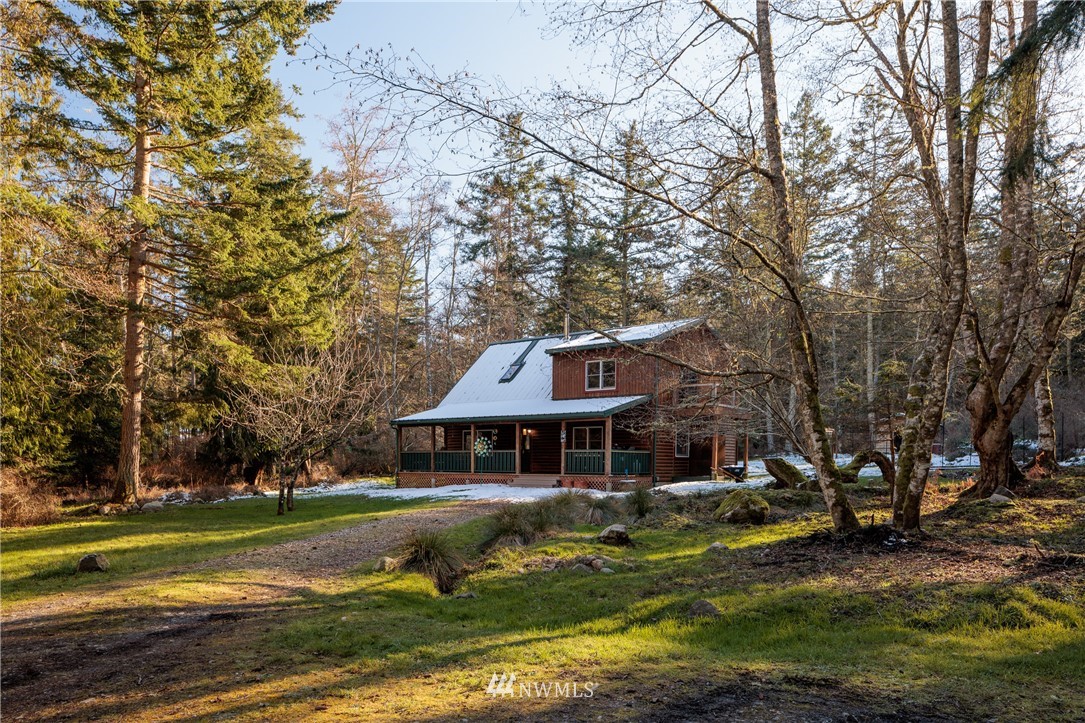 230 Eliza Road Lopez Island, WA 98261 - Photo 26 of 26 a front view of a house with a yard table and chairs