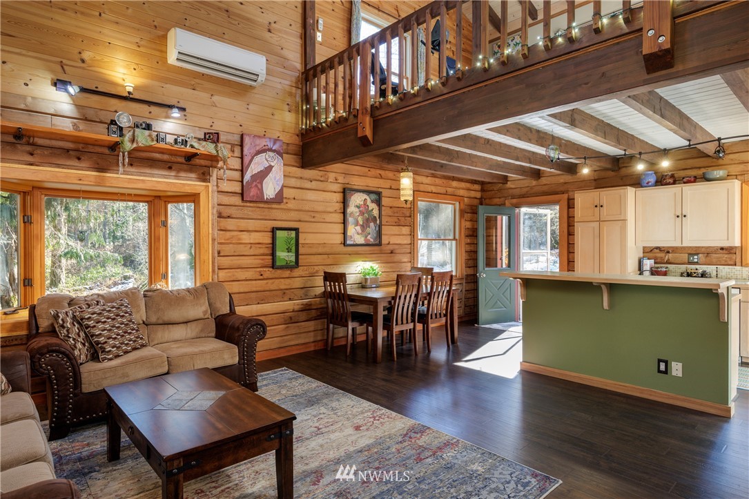 230 Eliza Road Lopez Island, WA 98261 - Photo 3 of 26 a living room with lots of furniture and a wooden floors