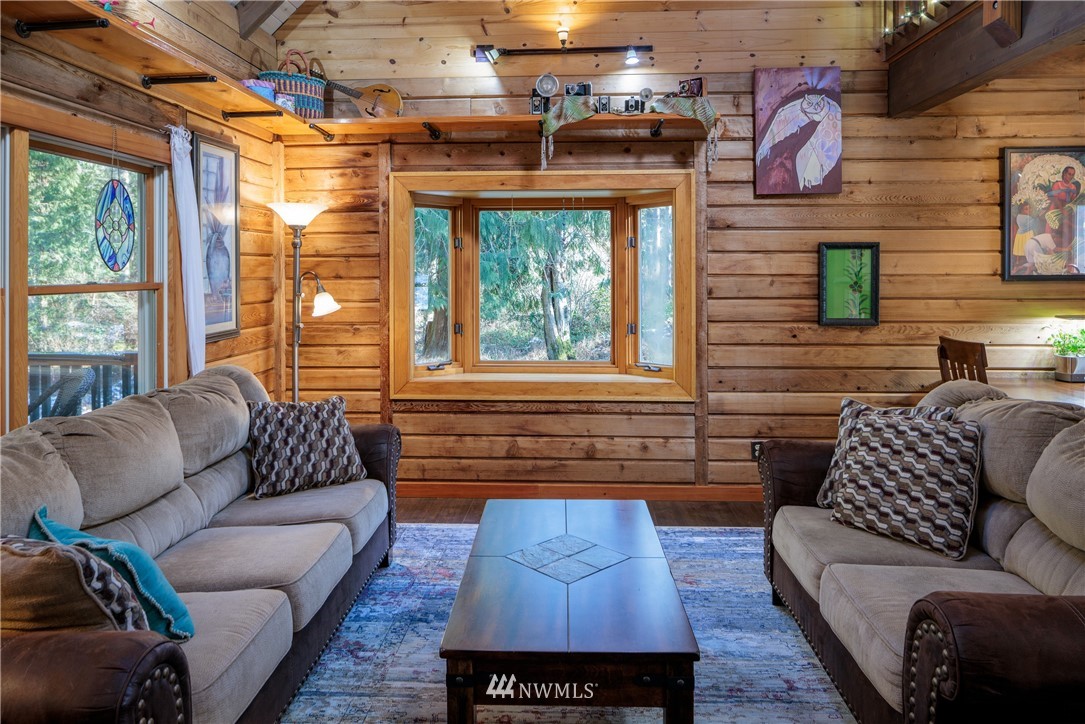 230 Eliza Road Lopez Island, WA 98261 - Photo 5 of 26 a living room with furniture and a large window