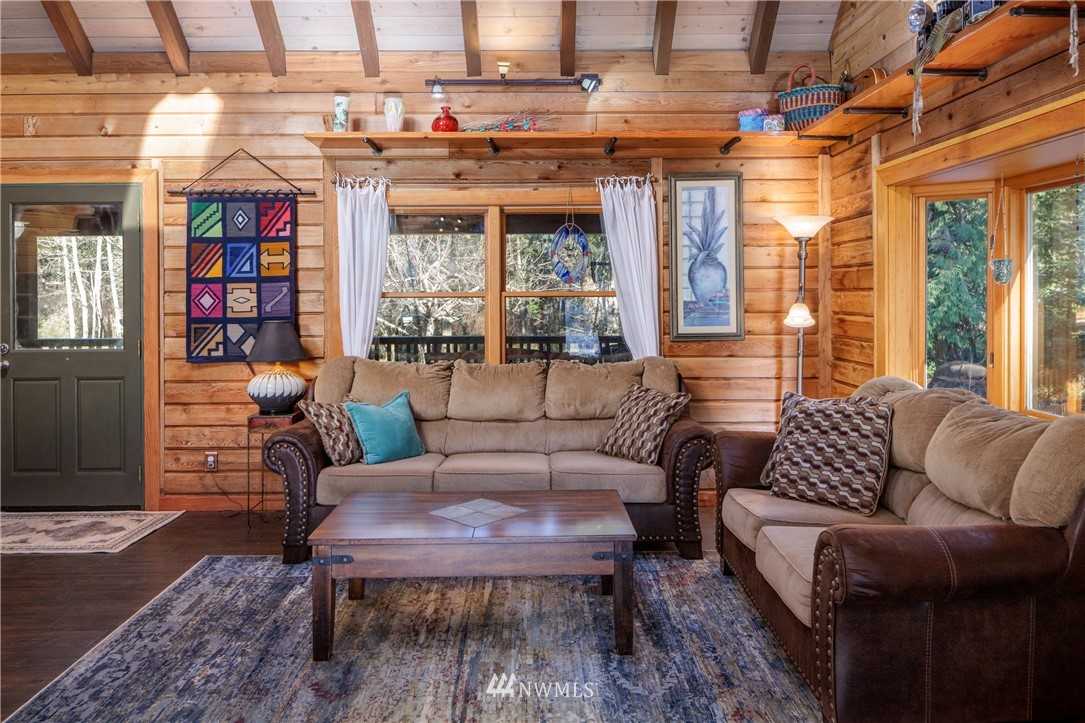 230 Eliza Road Lopez Island, WA 98261 - Photo 6 of 26 a outdoor living space with furniture and a potted plant
