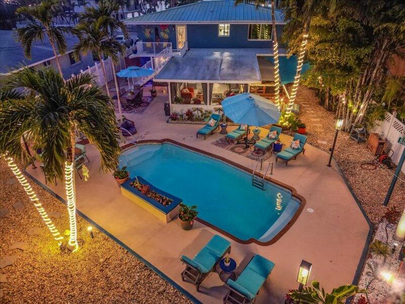 7949 Gulfstream Boulevard Marathon, FL 33050 - Photo 53 of 64 an aerial view of a house with a swimming pool patio and outdoor seating