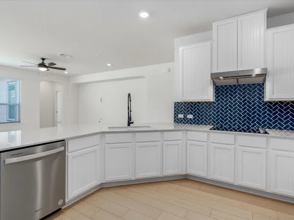 a kitchen with a sink and cabinets