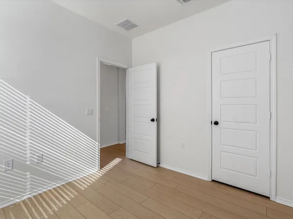 a view of a livingroom with wooden floor