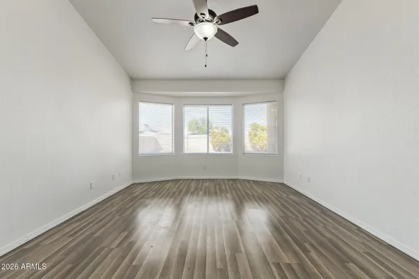 a spacious bathroom with a granite countertop sink mirror and a
