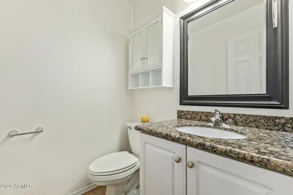 an empty room with a window and a ceiling fan